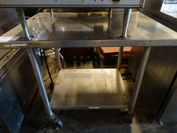 Stainless Steel Commercial Table w/ Metal Undershelf on Commercial Casters. 36x30x40 - Image 1 of 3