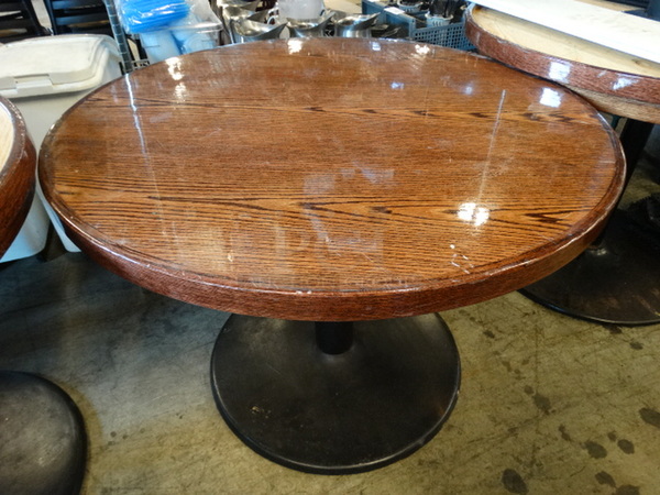 Butcher Block Wooden Pattern Round Table on Black Metal Table Base. Stock Picture - Cosmetic Condition May Vary. 42x42x31