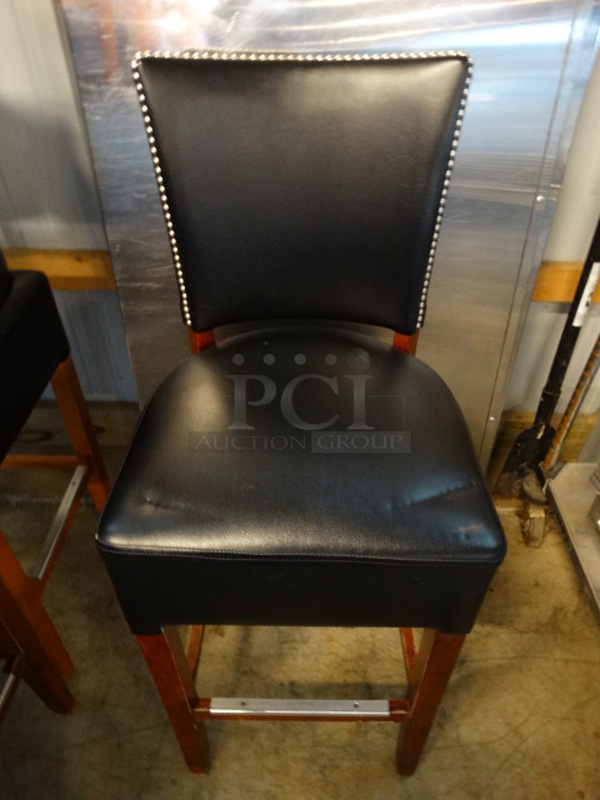 2 Bar Height Chairs w/ Black Cushions and Wood Pattern Frame. Stock Picture - Cosmetic Condition May Vary. 18x18x44. 2 Times Your Bid!