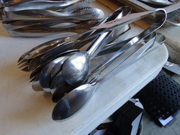 11 Metal Tongs. 11