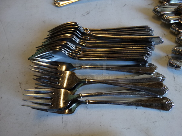 22 Metal Forks. 7