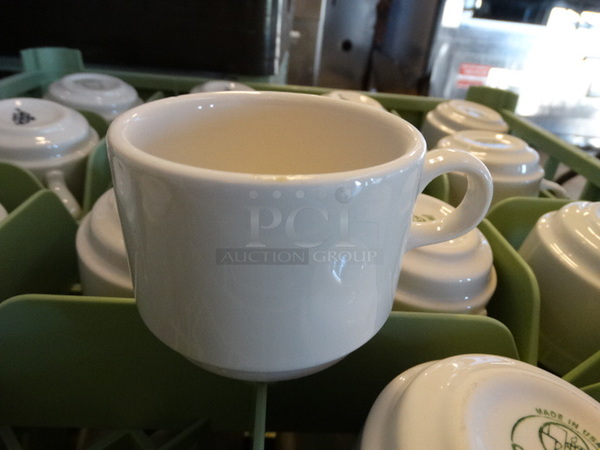 16 White Ceramic Mugs in Dish Caddy. 4.5x3.5x2.5. 16 Times Your Bid!