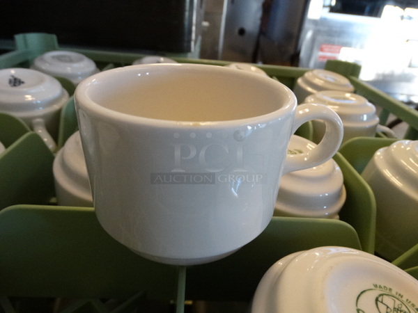 16 White Ceramic Mugs in Dish Caddy. 4.5x3.5x2.5. 16 Times Your Bid! - Image 1 of 2