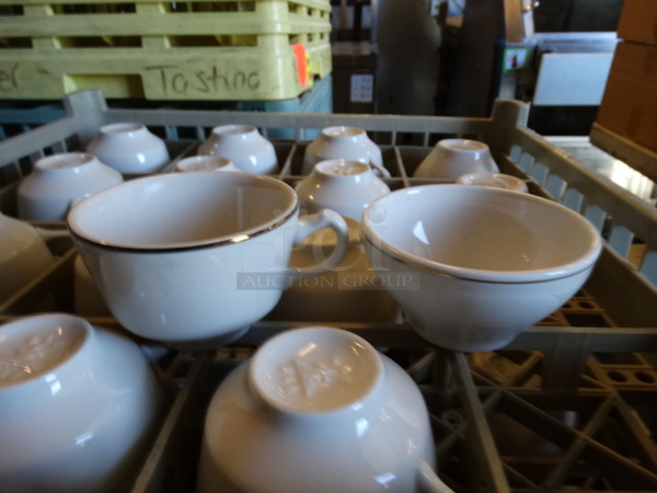 16 White Ceramic Mugs and Bowls in Dish Caddy. 4x4x2.5, 4.5x3.5x2.5. 16 Times Your Bid!