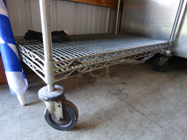 Chrome Finish 2 Tier Metro Shelving Unit on Commercial Casters. 42x24x68. BUYER MUST DISMANTLE. PCI CANNOT DISMANTLE FOR SHIPPING. PLEASE CONSIDER FREIGHT CHARGES.  - Image 2 of 3