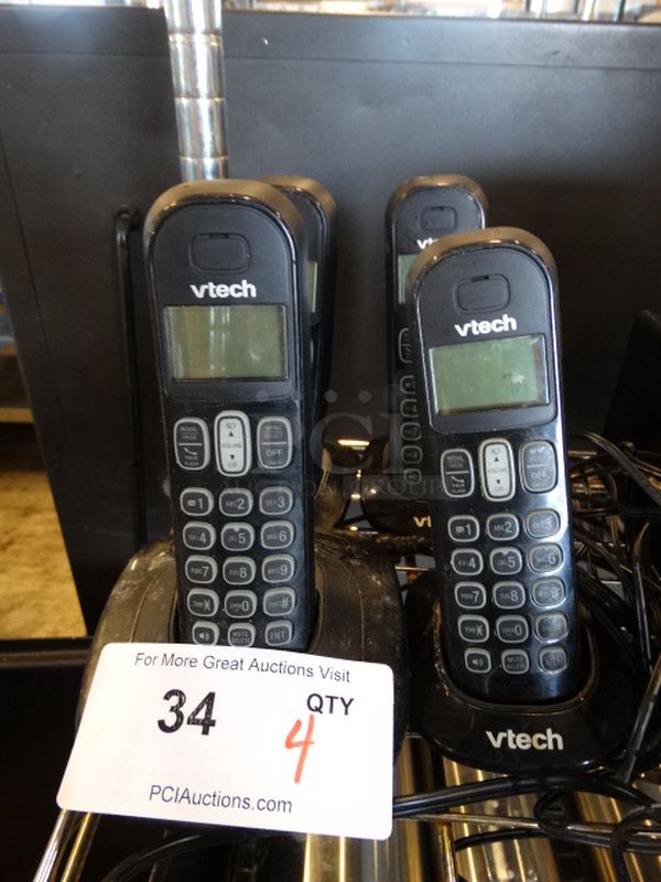 4 Vtech Phones in Cradle. 3x3x7. 4 Times Your Bid!