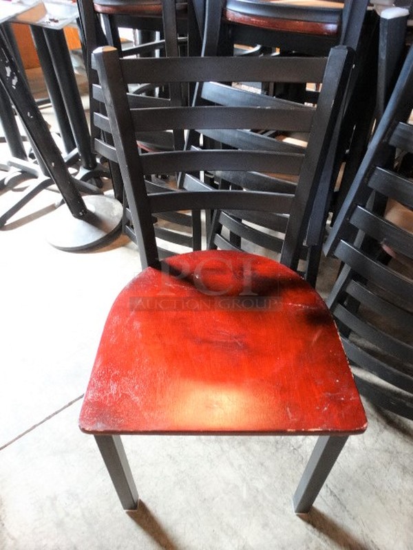 4 Black Metal Dining Height Chairs w/ Wood Pattern Seat. Stock Picture - Cosmetic Condition May Vary. 17x17x32. 4 Times Your Bid! - Image 1 of 7