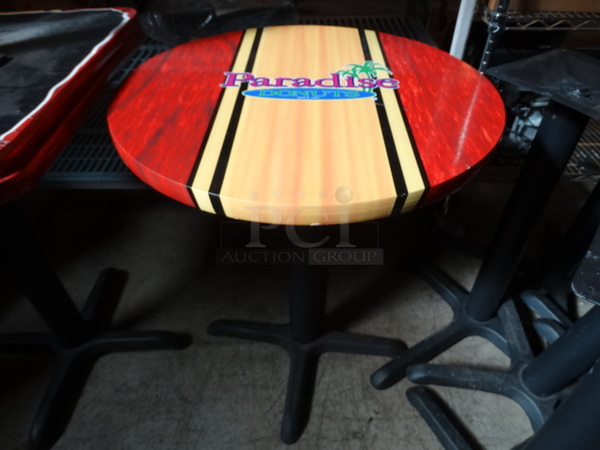 Round Table on Black Metal Table Leg w/ Paradise Logo. Stock Picture - Cosmetic Condition May Vary. 24x24x29