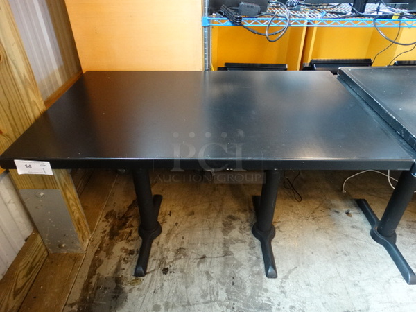 Black Tabletop on 2 Black Metal Table Bases. Stock Picture - Cosmetic Condition May Vary. 48x30x30