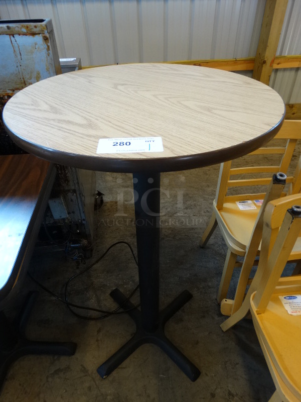 Light Wood Pattern Round Tabletop w/ Dark Wood Pattern Underside on Black Metal Bar Height Table Base. 24x24x41