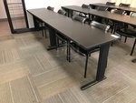 (2) Black Laminated Wooden Desks w/ 4 Herman Miller Vinyl Task Chairs