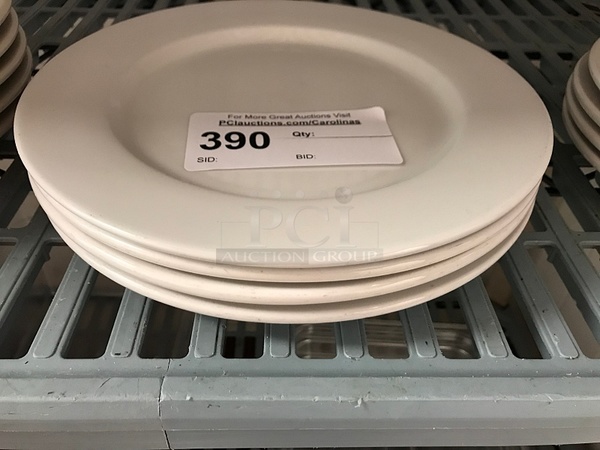 Four Porcelain Dinner Plates