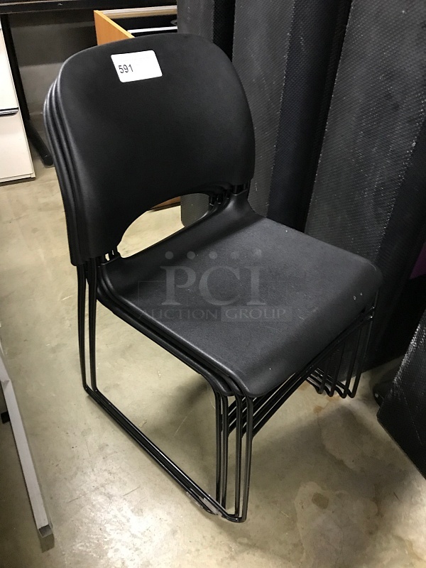 Four Black Stackable Chairs