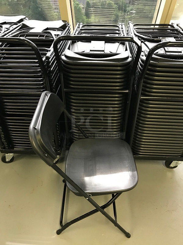 Twenty Five Folding Black Plastic & Metal Frame Chairs on Transport Dolly
