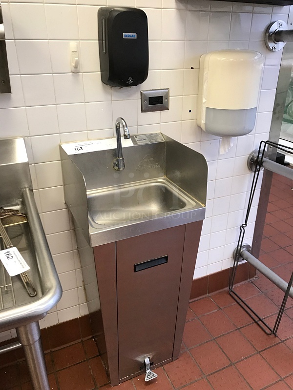 Advance Tabco Stainless Steel Pedestal Hand Sink w/ Foot Controls w/ Tork Pull Hand Towel Dispenser & Ecolab Automatic Hand Soap Dispenser 