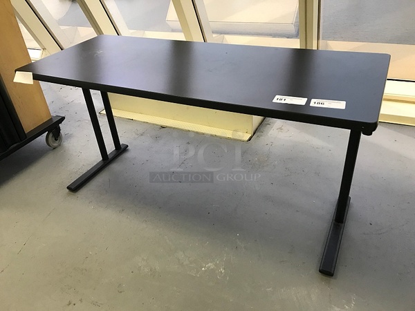 Two Herman Miller Black Wooden Desks on Metal Legs