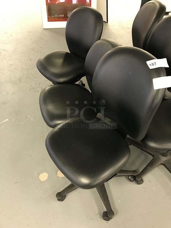 Three Vinyl Padded Black Herman Miller task Chairs