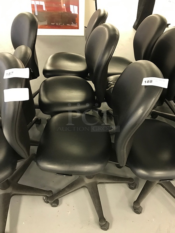 Three Vinyl Padded Black Herman Miller task Chairs
