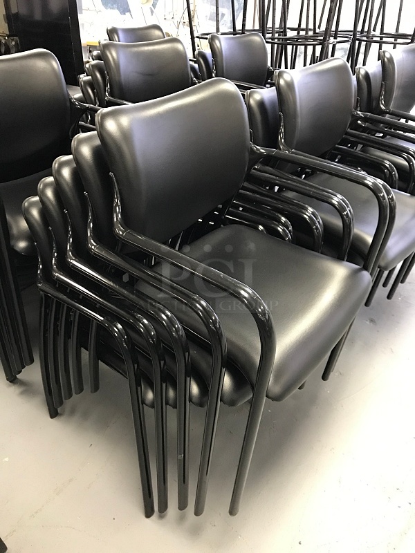 Five Black Stackable Herman Miller Chairs