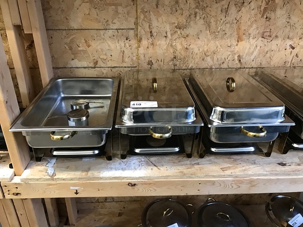 Three Stainless Steel Chafing Dishes on Stands