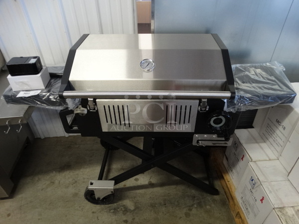 BRAND NEW IN BOX! Glaros Model BBQP-SS Stainless Steel Portable BBQ Grill on Casters. Comes w/ Rotisserie Spit, 2 Cooking Stones and Cover! Stock Picture Used To Show Item - Comes Disassembled In Box. 56x21x41