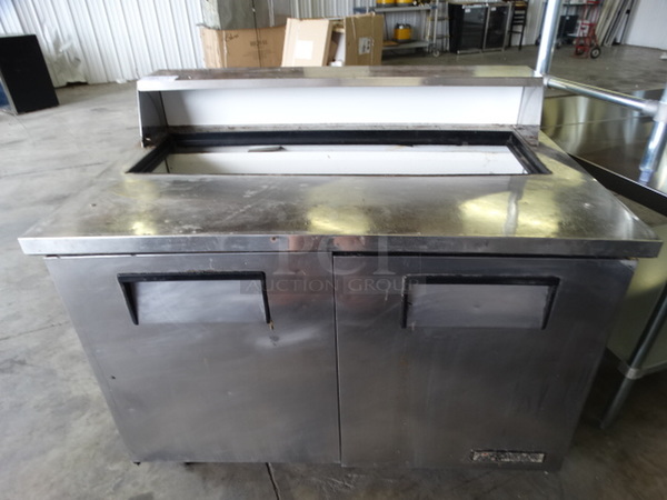 NICE! 2005 True Model TSSU-48-12 Stainless Steel Commercial SAndwich Salad Prep Table on Commercial Casters. 115 Volts, 1 Phase. 48x30x44. Tested and Powers On But Does Not Get Cold