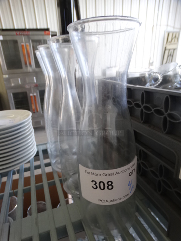 4 Poly Clear Wine Carafes. 3.5x3.5x10.5. 4 Times Your Bid!
 - Image 1 of 3