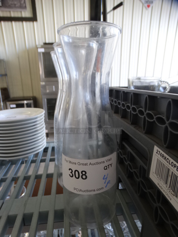4 Poly Clear Wine Carafes. 3.5x3.5x10.5. 4 Times Your Bid!
 - Image 2 of 3