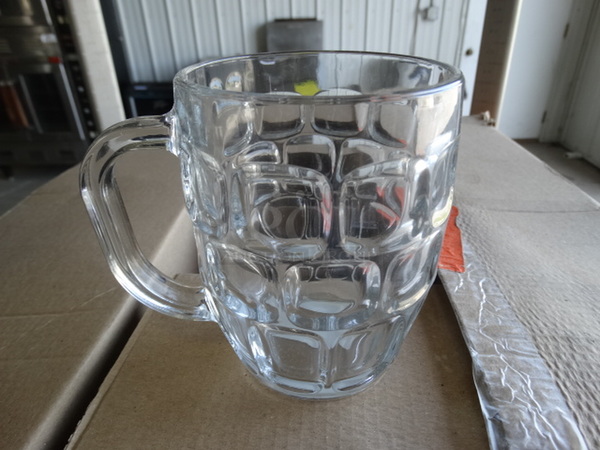 12 BRAND NEW IN BOX! Glass Mugs. 5.5x4x5. 12 Times Your Bid!
