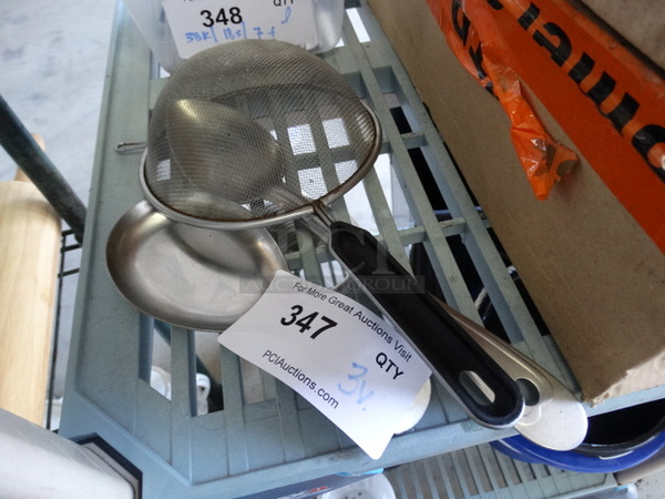 3 Metal Utensils; Serving Spoon, Spoon Rest and Strainer. 3 Times Your Bid!
