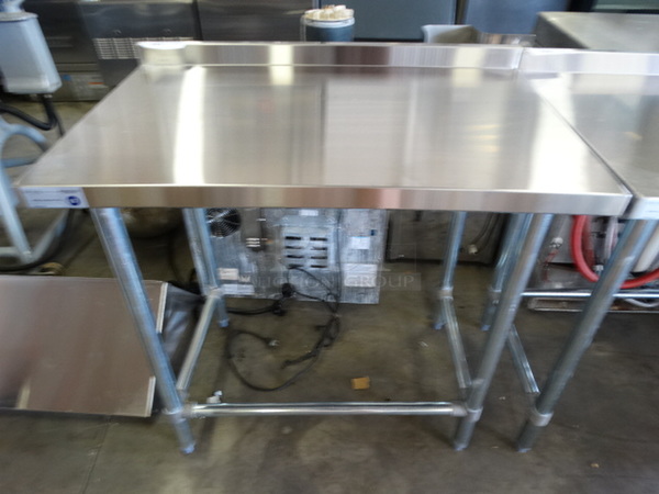 BRAND NEW IN BOX! Serv Ware Model T2436CWP-4-T-OB Stainless Steel Commercial Table w/ Backsplash. Stock Picture - Unit Is Disassembled In Box. 36x24x36 - Image 1 of 6