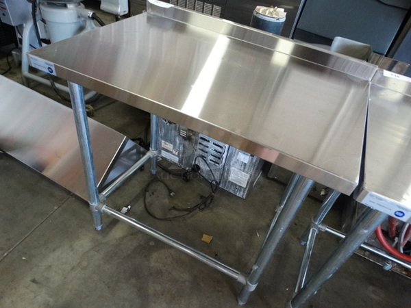 BRAND NEW IN BOX! Serv Ware Model T2436CWP-4-T-OB Stainless Steel Commercial Table w/ Backsplash. Stock Picture - Unit Is Disassembled In Box. 36x24x36 - Image 2 of 6