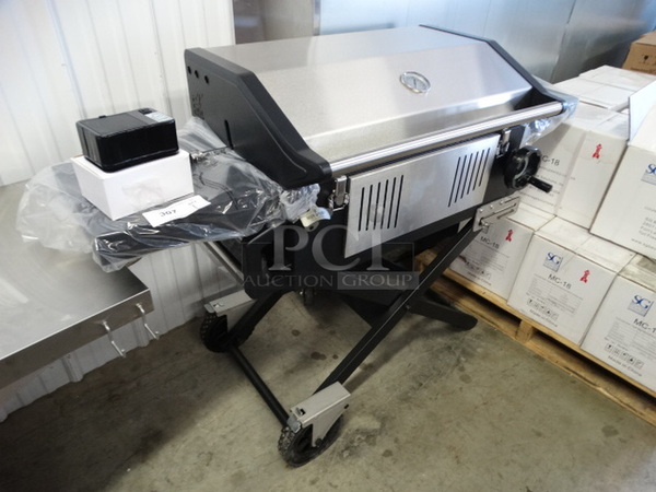 BRAND NEW IN BOX! Glaros Model BBQP-SS Stainless Steel Portable BBQ Grill on Casters. Comes w/ Rotisserie Spit, 2 Cooking Stones and Cover! Stock Picture Used To Show Item - Comes Disassembled In Box. 56x21x41 - Image 3 of 11