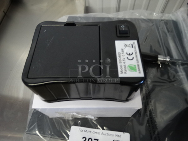 BRAND NEW IN BOX! Glaros Model BBQP-SS Stainless Steel Portable BBQ Grill on Casters. Comes w/ Rotisserie Spit, 2 Cooking Stones and Cover! Stock Picture Used To Show Item - Comes Disassembled In Box. 56x21x41 - Image 4 of 11