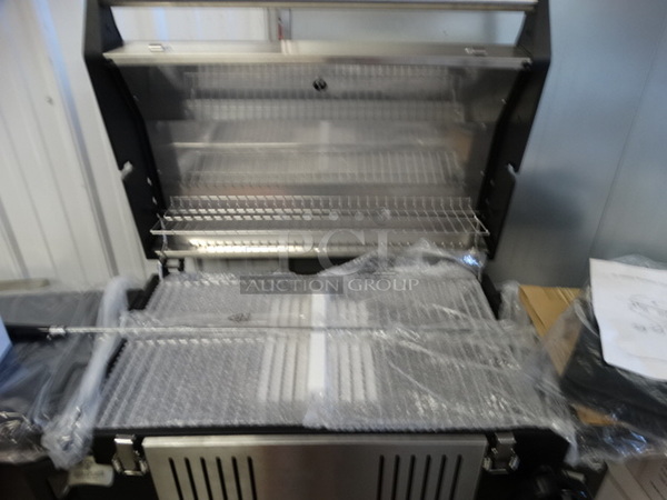 BRAND NEW IN BOX! Glaros Model BBQP-SS Stainless Steel Portable BBQ Grill on Casters. Comes w/ Rotisserie Spit, 2 Cooking Stones and Cover! Stock Picture Used To Show Item - Comes Disassembled In Box. 56x21x41 - Image 8 of 11