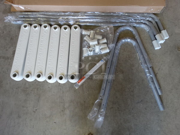 IN ORIGINAL BOX! Pieces to Gray Metal and Tan Poly Ladder.  - Image 1 of 5