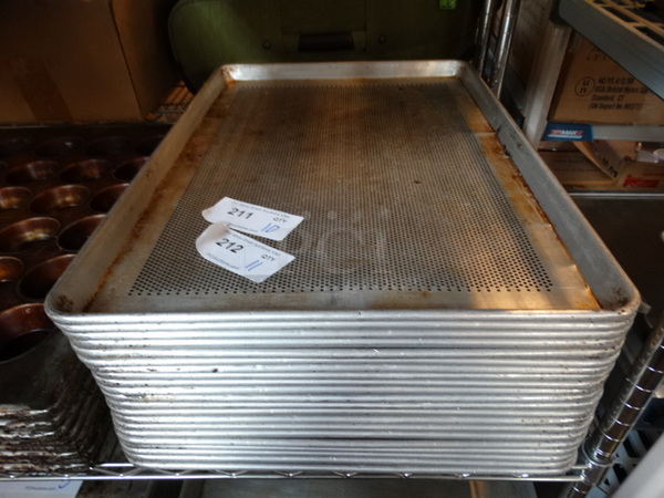 11 Metal Perforated Full Size Baking Pans. 18x26x1. 11 Times Your Bid!