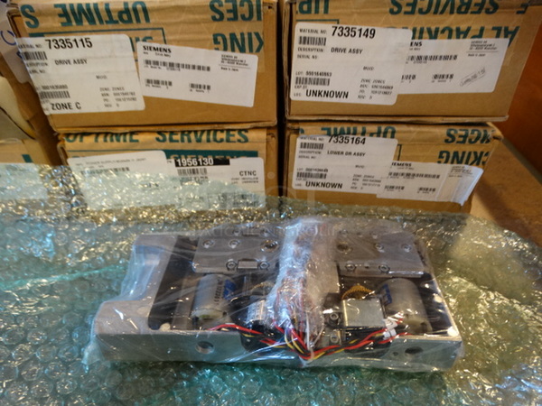 5 BRAND NEW IN BOX! Philips Units; 7335149 Drive Assembly, 7335164 Lower Drive Assembly, 1956130 Power Supply, 7335115 Drive Assembly and 7335099 Drive Assembly. 5 Times Your Bid!