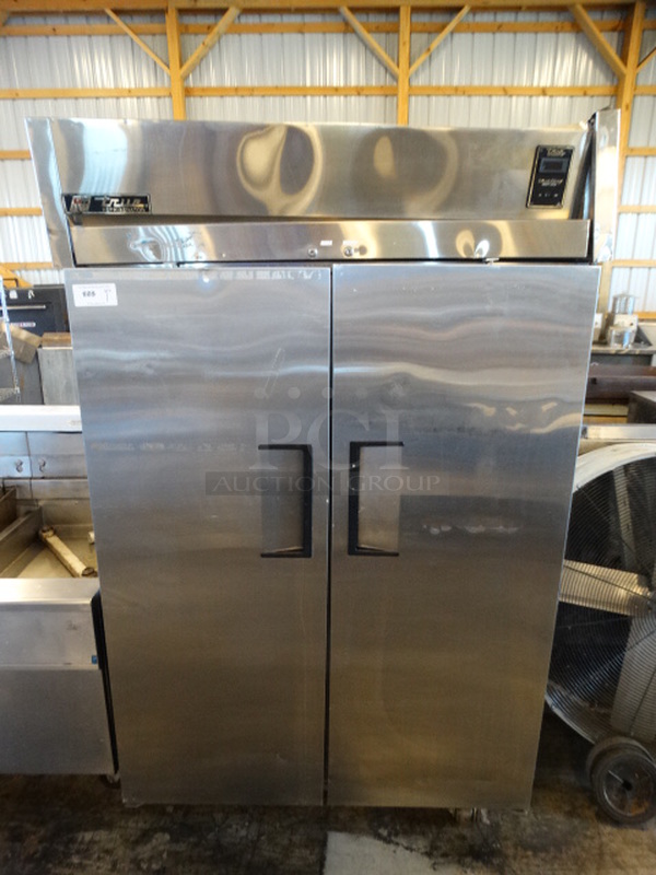 NICE! 2007 True Model TG2R-2S Stainless Steel Commercial 2 Door Reach In Cooler on Commercial Casters. 115 Volts, 1 Phase. 50x35x83. Tested and Working!