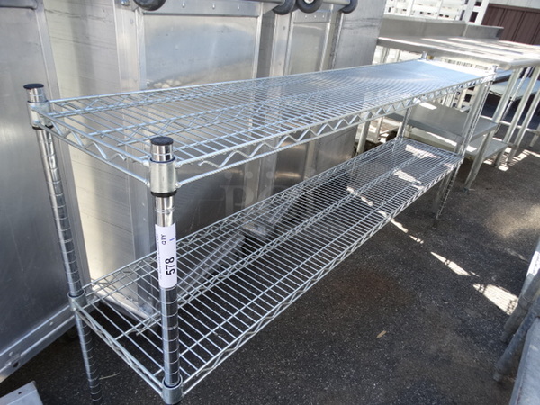 Chrome Finish 2 Tier Shelving Unit. 72x14x35. BUYER MUST DISMANTLE. PCI CANNOT  DISMANTLE FOR SHIPPING. PLEASE CONSIDER FREIGHT CHARGES. 