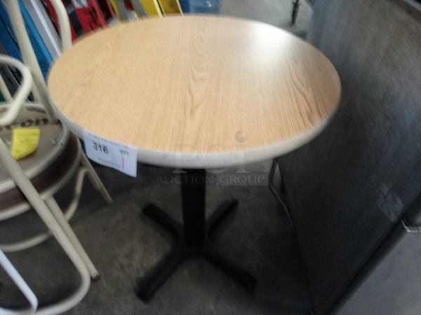 Round Wood Pattern Table on Black Metal Table Base. 24x24x30