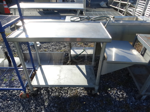 Stainless Steel Table w/ Undershelf and Side Shelf on Commercial Casters. 57x23x39
