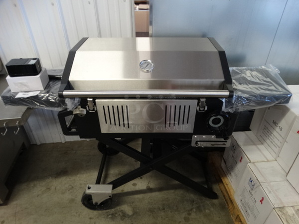 BRAND NEW IN BOX! Glaros Model BBQP-SS Stainless Steel Portable BBQ Grill on Casters. Comes w/ Rotisserie Spit, 2 Cooking Stones and Cover! Stock Picture Used To Show Item - Comes Disassembled In Box. 56x21x41