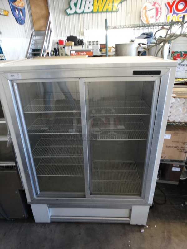 NICE! Fogel Model R-38WDAB Metal Commercial Reach In Cooler Merchandiser w/ Poly Coated Racks. 115 Volts, 1 Phase. 56x32x76. Tested and Powers On But Temps at 47 Degrees