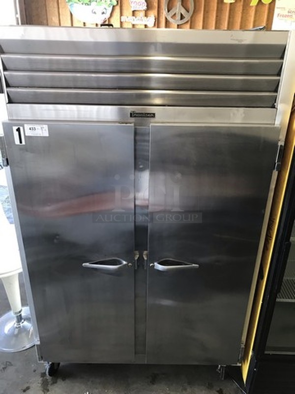 GREAT! Traulsen Model G22010 Stainless Steel Commercial 2 Door Reach In Freezer on Commercial Casters. 115 Volts, 1 Phase. 52x34x83. Could Not Test Due To Plug Style