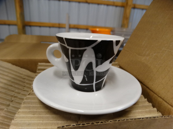 3 BRAND NEW IN BOX! Sets of White and Black Mug and White Saucer. 4.5x4.5x0.5, 3x2.5x2.5. 3 Times Your Bid!