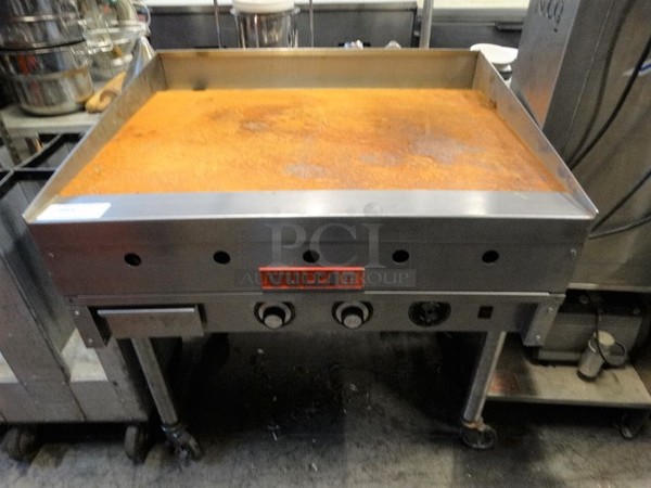 GREAT! Vulcan Stainless Steel Commercial Gas Powered Flat Top Griddle w/ Thermostatic Controls on Commercial Casters. 36x32.5x38
