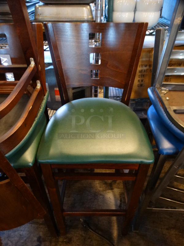 3 Wood Pattern Bar Height Chairs w/ Green Seat Cushion. Stock Picture - Cosmetic Condition May Vary. 18x17x44. 3 Times Your Bid!