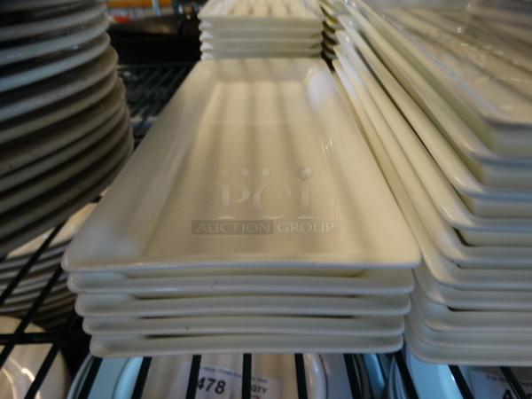 55 White Ceramic Plates. 4.5x10.5x1. 55 Times Your Bid!