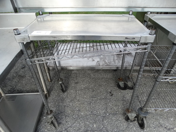 Chrome Finish 2 Tier Metro Shelving Unit on Commercial Casters. 30x18x35. BUYER MUST DISMANTLE. PCI CANNOT  DISMANTLE FOR SHIPPING. PLEASE CONSIDER FREIGHT CHARGES.  - Image 1 of 3